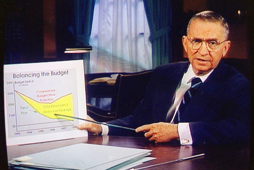 A man points to a chart with a stick.