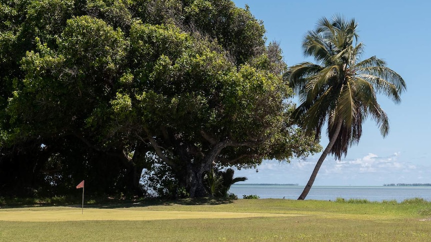 The golf course stretches across to the lagoon.