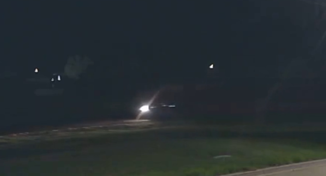 a blurry photo of a car on a dark road