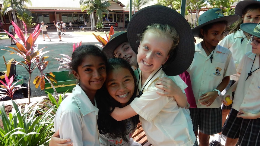 Indonesian language students hugging and smiling Townsville Grammar School.
