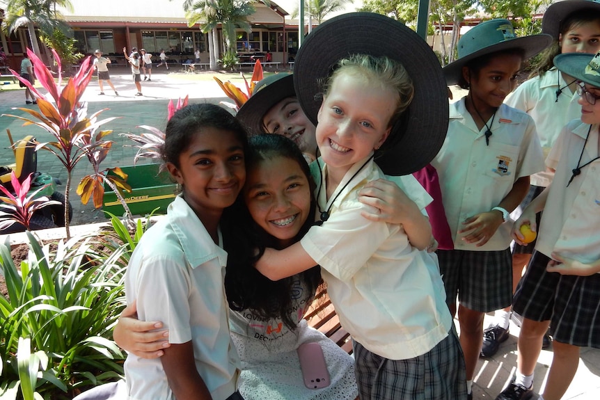Indonesian language students hugging and smiling Townsville Grammar School.