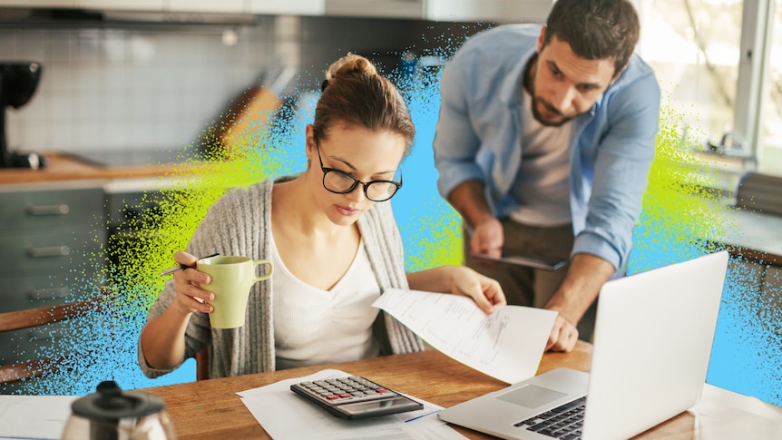 Couple discussing finances in front of computer surrounded by colour treatment as the woman holds a mug