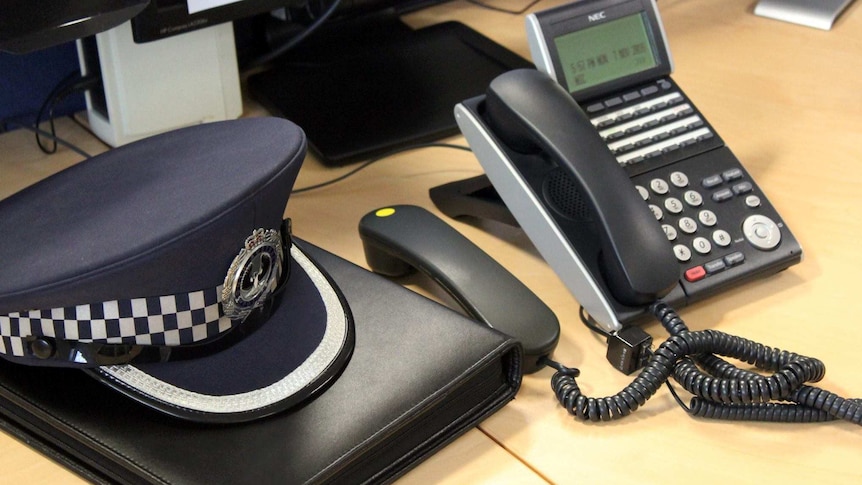 The hat of a South Australian police officer sits on a desk.