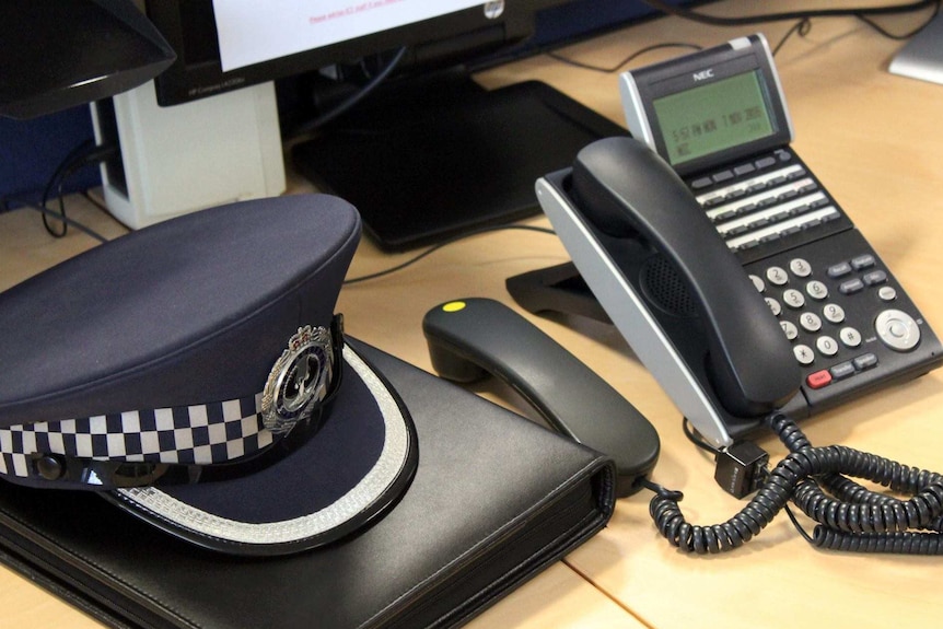 The hat of a South Australian police officer sits on a desk.