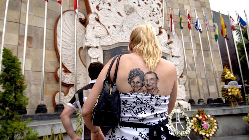 An Australian woman takes part in the memorial service in Bali