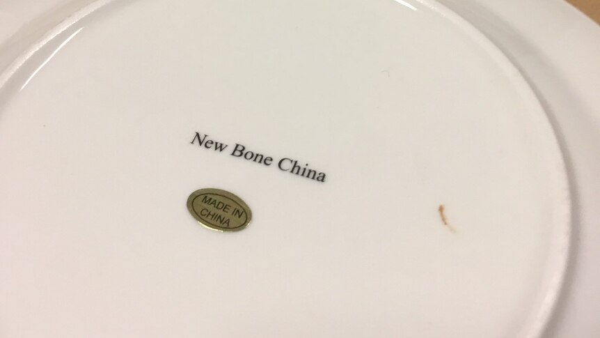 Made in china label on the back of a fake Aboriginal style art plate