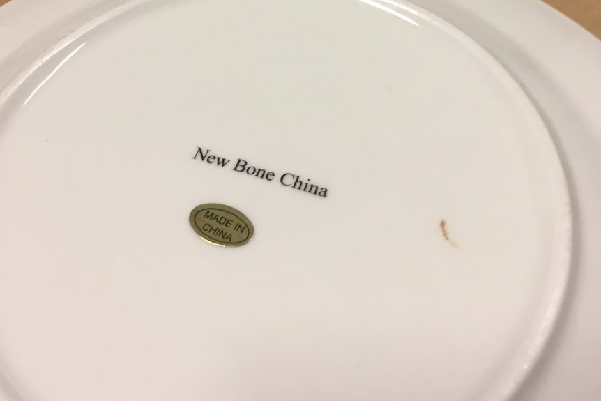 Made in china label on the back of a fake Aboriginal style art plate