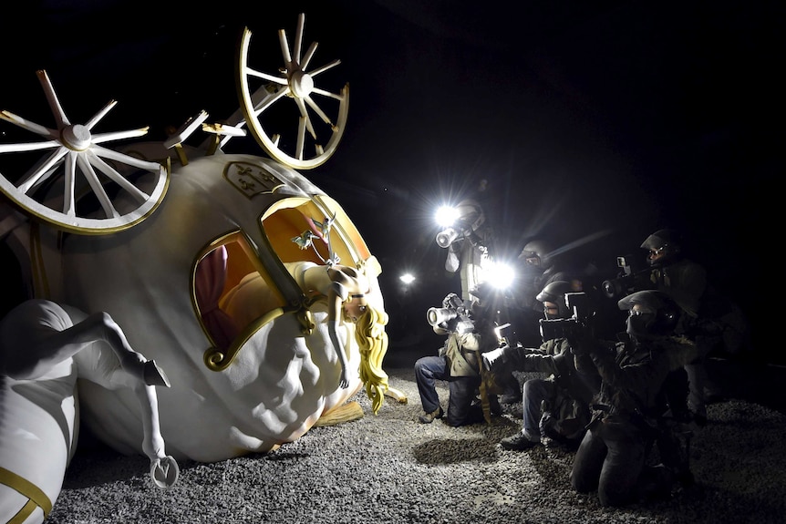 Cinderella's pumpkin carriage carnage at Dismaland bemusement park by British artist Banksy in the UK