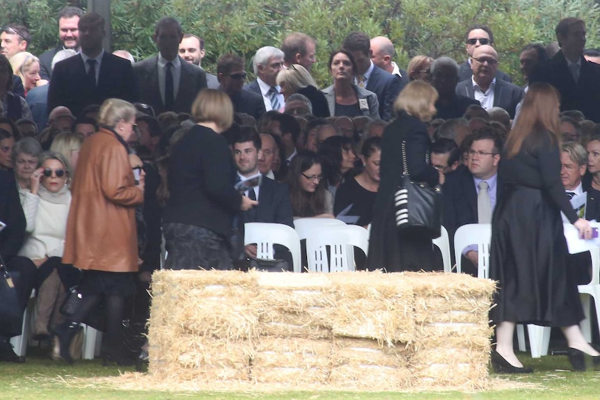 People gather at the funeral for Don Randall in Perth