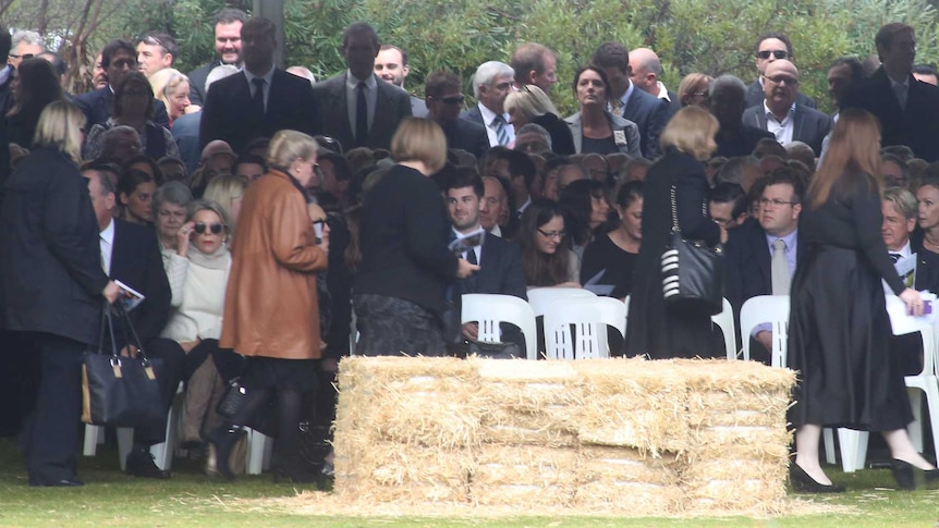 People gather at the funeral for Don Randall in Perth
