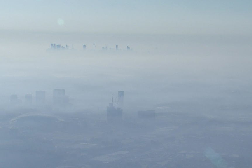 A city horizon obscured by thick haze.