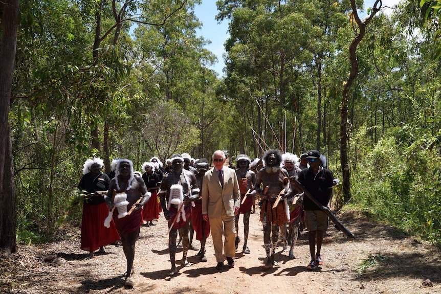 Prince Charles walks with traditional owners in Nhulunbuy.