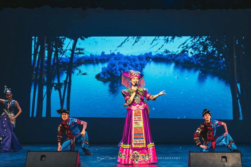 A singer and three dancers from China perform at the Bundaberg 2019 Chinese New Year celebration.