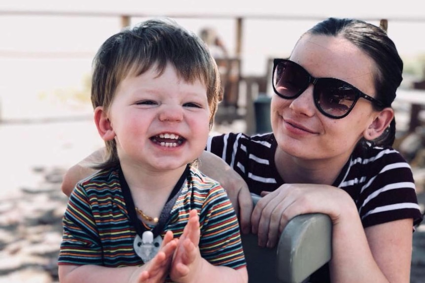 Mum Natasha Scott holds her son Ruben.