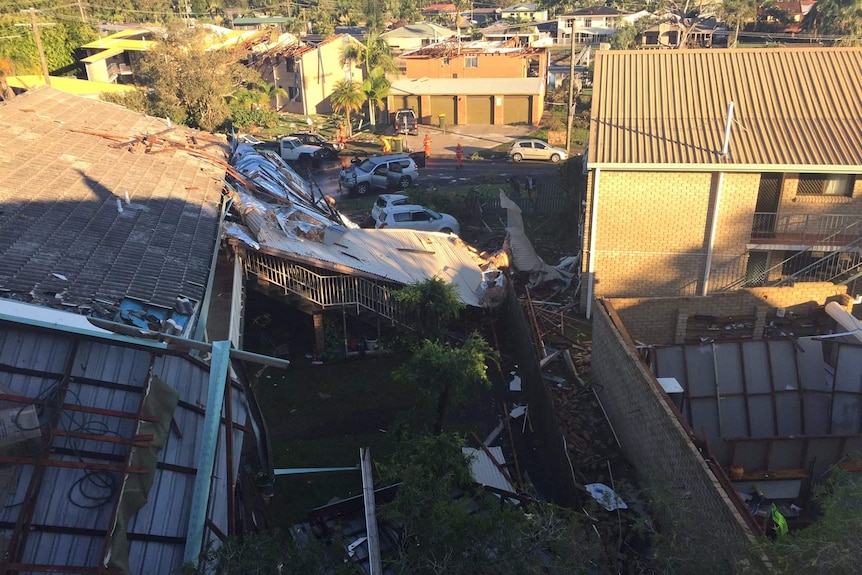 Homes are exposed, debris on the road after a severe storm