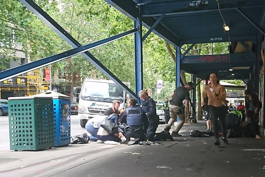 Police and emergency services at the scene of the Bourke St attack.