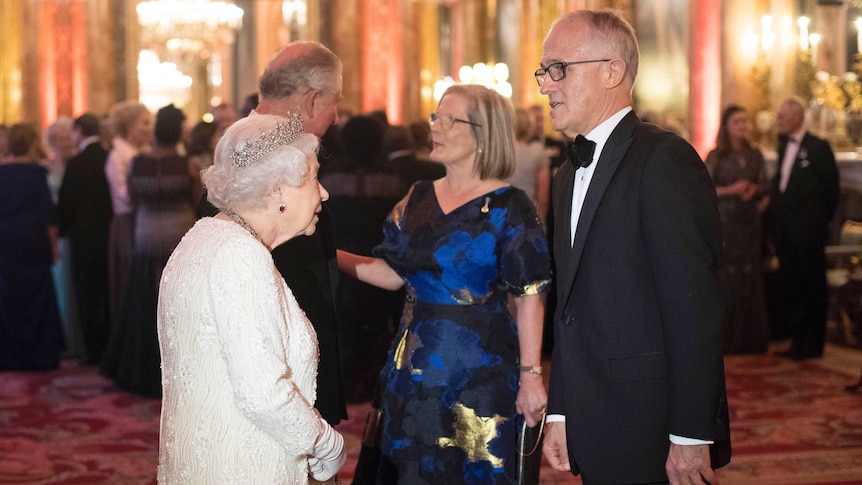 Prime Minister Malcolm Turnbull speaks to Queen Elizabeth II, while his wife Lucy speaks to Prince Charles.