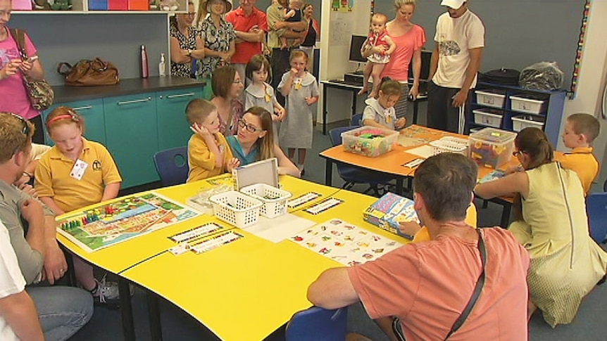 Kindergarten students and their parents at the redesigned Taylor Primary School in Canberra on the first day of school for 2014.