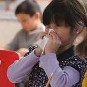 child sneezing at school