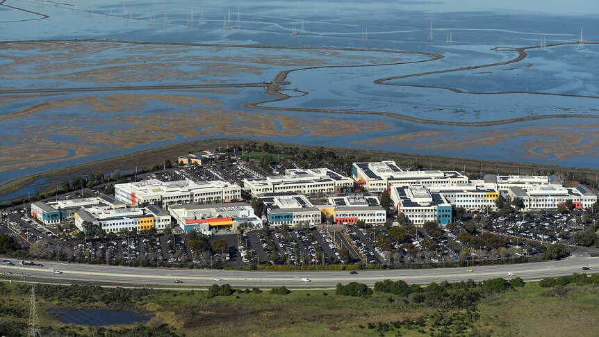 An aerial shot of the facebook offices in san jose near lagoons