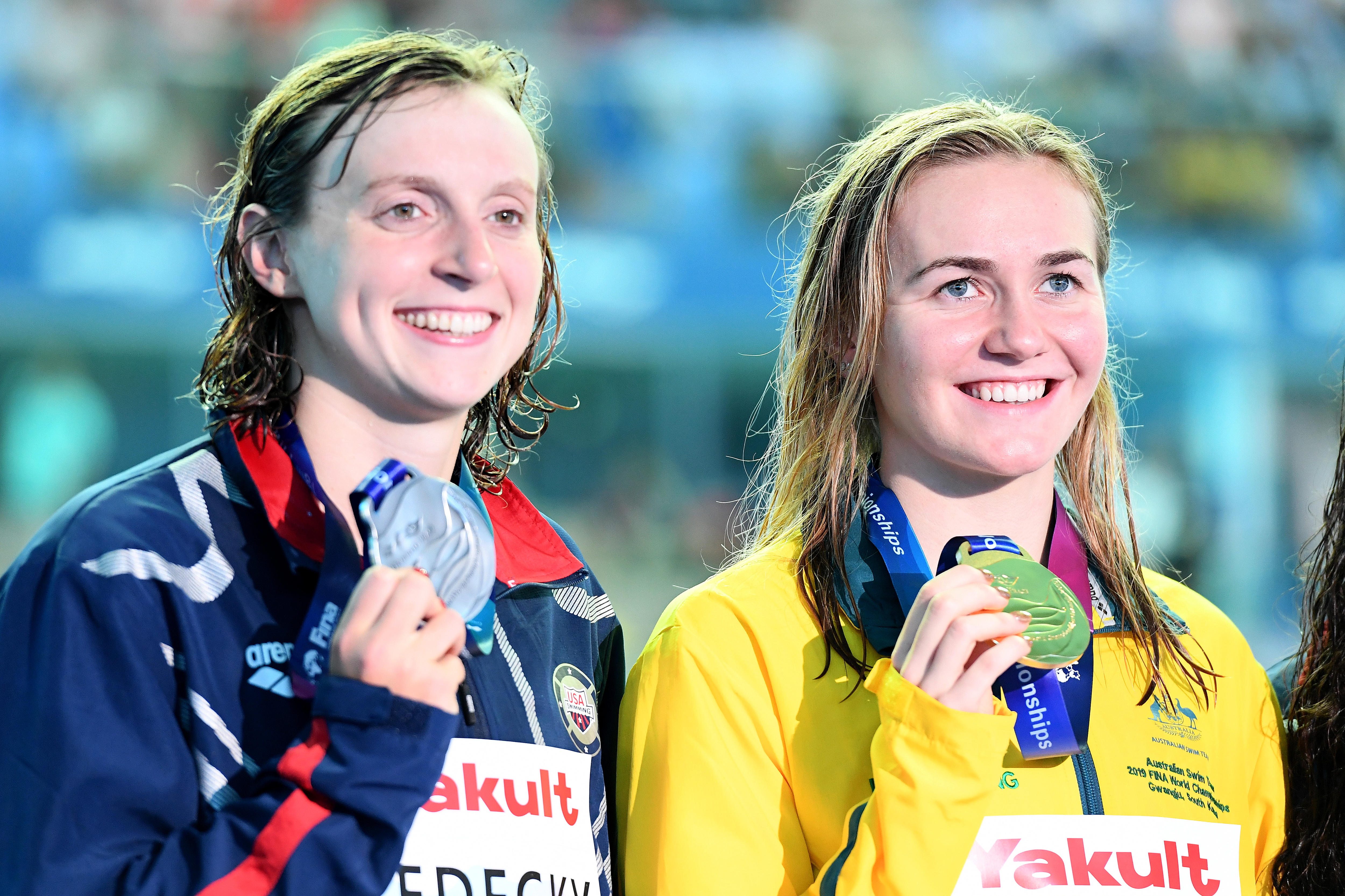 Katie Ledecky and Ariarne Titmus hold medals