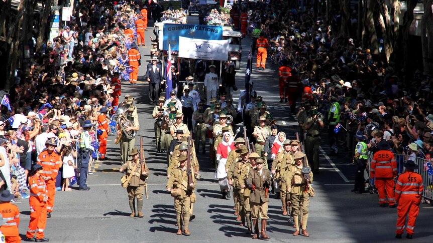 The Anzac Day parade makes its way through the Brisbane CBD.