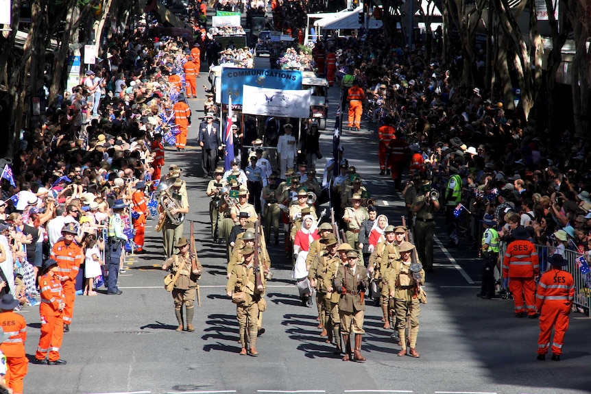 The Anzac Day parade makes its way through Brisbane's CBD.