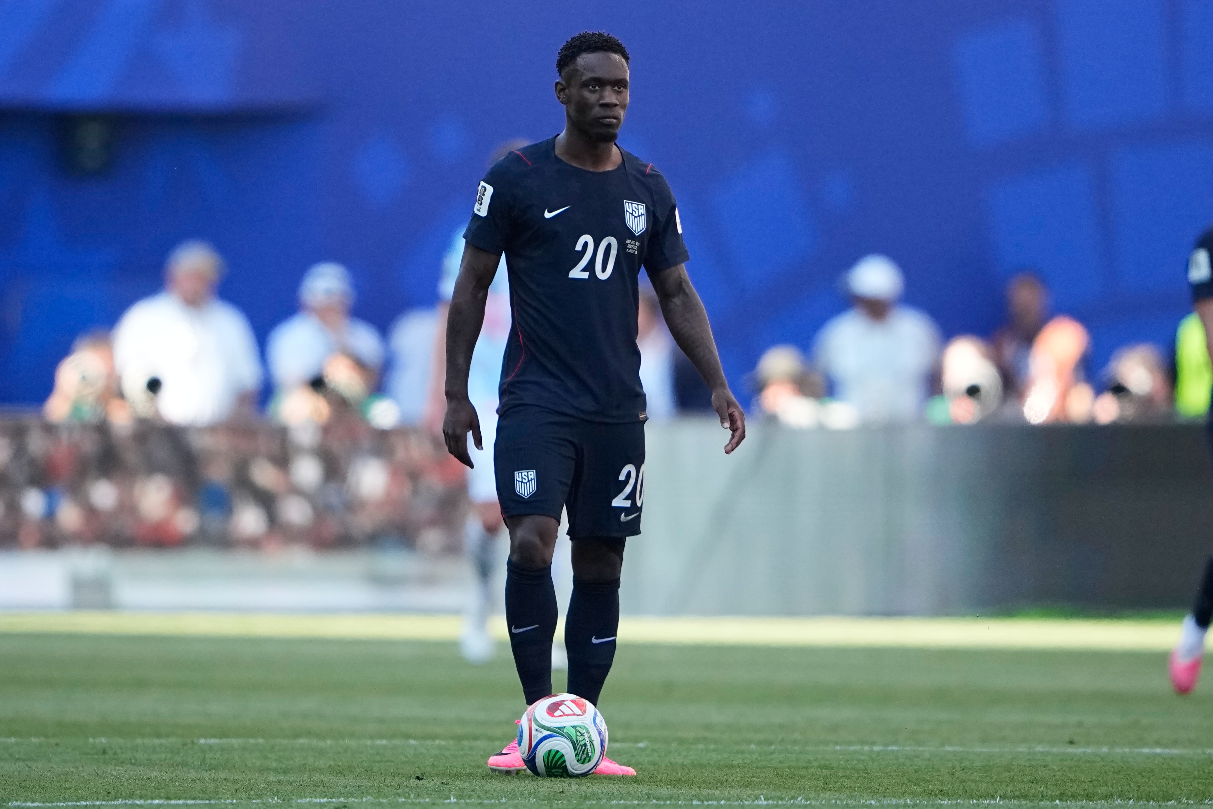 Folarin Balogun wearing his USA kit standing on the football pitch