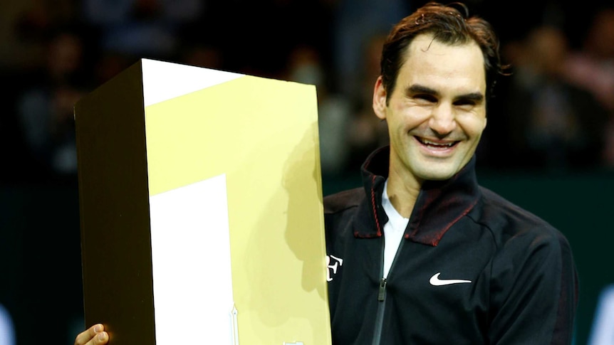 Roger Federer celebrates after defeating Robin Haase at Rotterdam Open to become world number one.