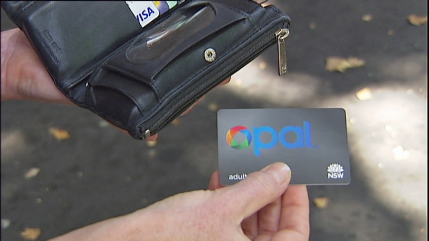 Generic picture of an unidentified woman holding an opal card