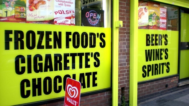 A sign saying 'frozen food's, cigarette's, chocolate'
