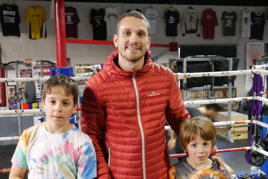 Stevie Spark and two young boxers