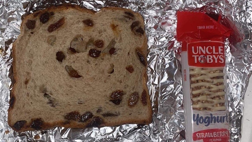 A meal of raisin toast and a muesli bar provided in an Adelaide medi-hotel.