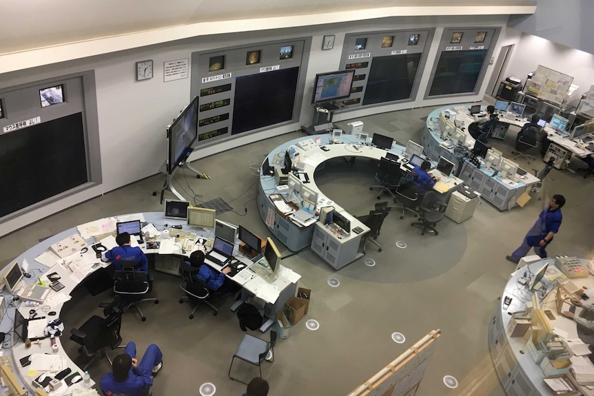 People work at the control room inside Japan's Isogo power plant