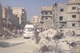 A Syrian army fighter jet crashed into a busy marketplace in Ariha.