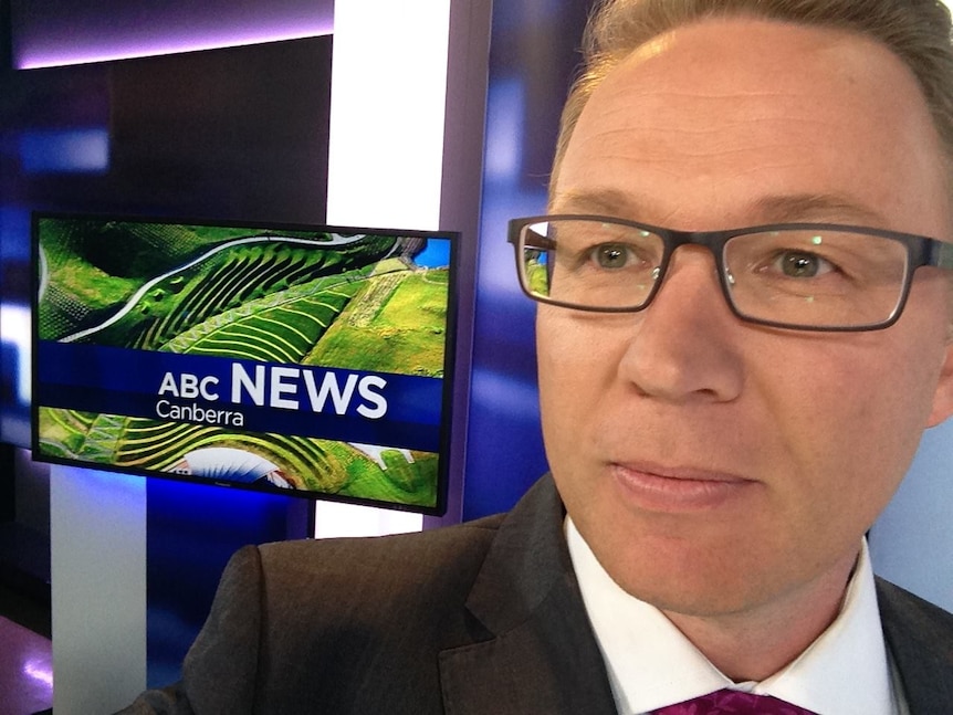 Craig Allen takes a selfie in the ABC News Canberra studio.