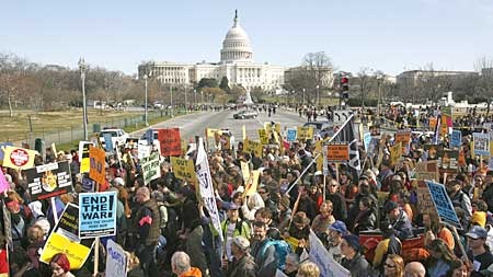 Aanti-war protesters march past the US Capitol building during a large peace protest in Washington (Jim Bourg: Reuters)