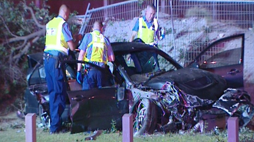 Police at the scene after a drunk driver crashed in the Perth suburb of Hillarys.