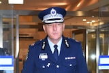 New South Wales Police Assistant Commissioner Michael Fuller walking out of building