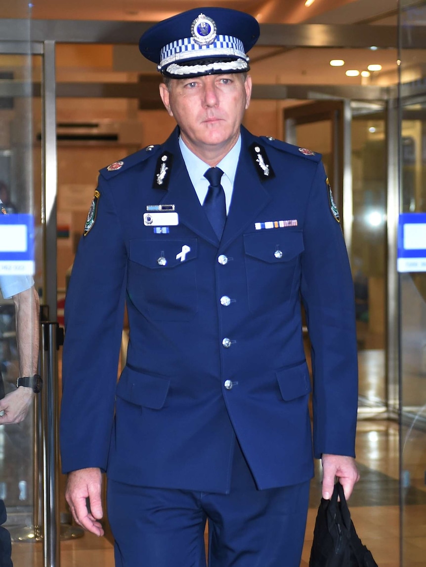 New South Wales Police Assistant Commissioner Michael Fuller walking out of building