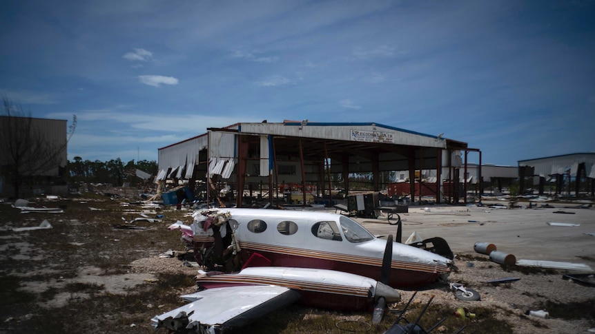 A plane destroyed by Hurricane Dorian sits amid debris at the airport in Freeport, Bahamas.