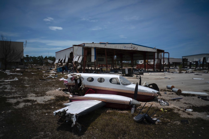 A plane destroyed by Hurricane Dorian sits amid debris at the airport in Freeport, Bahamas.
