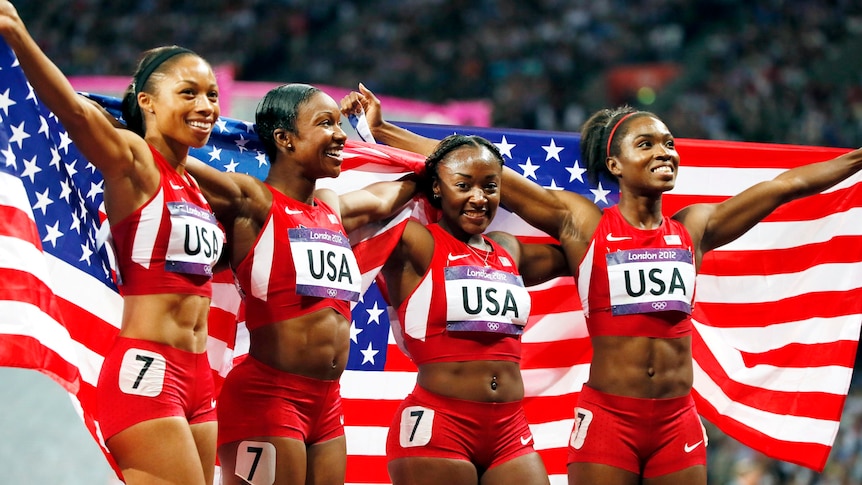 The US relay team celebrate winning the women's 4x100m relay final in a world record time.