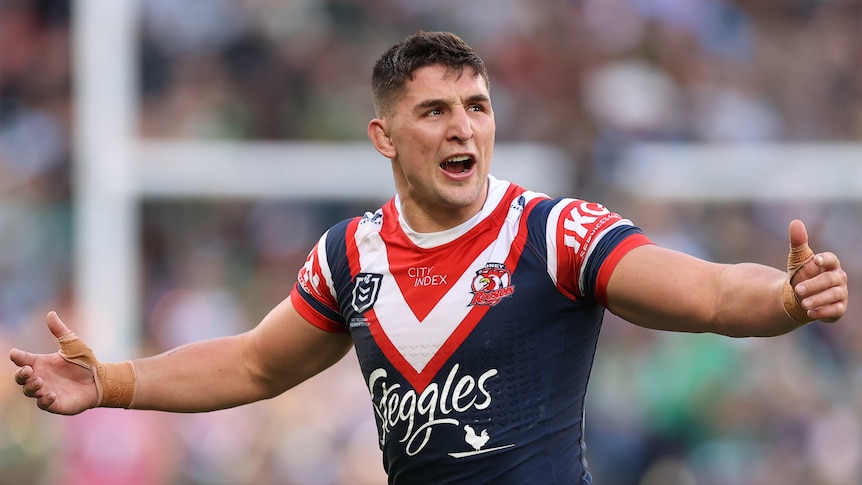 Sydney Roosters NRL player Victor Radley holds his arms out and shouts after being sin-binned during a final against Souths.