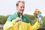 Australia's Curtis McGrath poses with his gold medal in men's KL2 para-canoeing at Rio Paralympics.