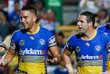 Parramatta Eels players (faces cropped out) with hands on hips