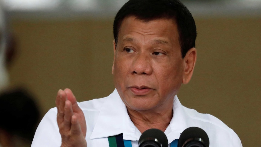 Philippines President Rodrigo Duterte gestures during Change of Command ceremonies.