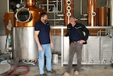 Two men in distillery