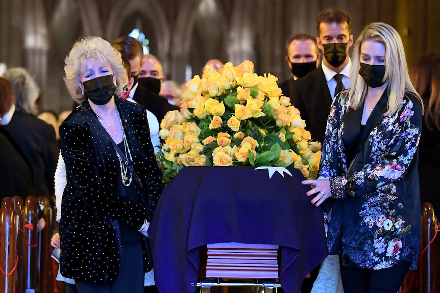 Patti and Lauren Newtown lead pallbearers during the State Funeral Service for Bert Newton