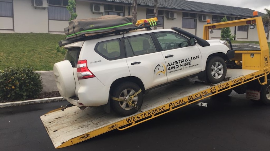An Australian 4WD Hire car being loaded onto a tow truck